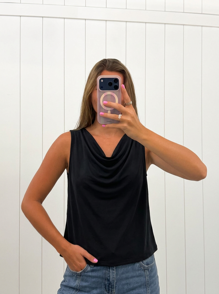 AI-assisted FASHN try-on of Black Sleeveless Cowl Neck Top on boutique owner; approved September 24, 2026 redo using IMG_5188.jpeg.