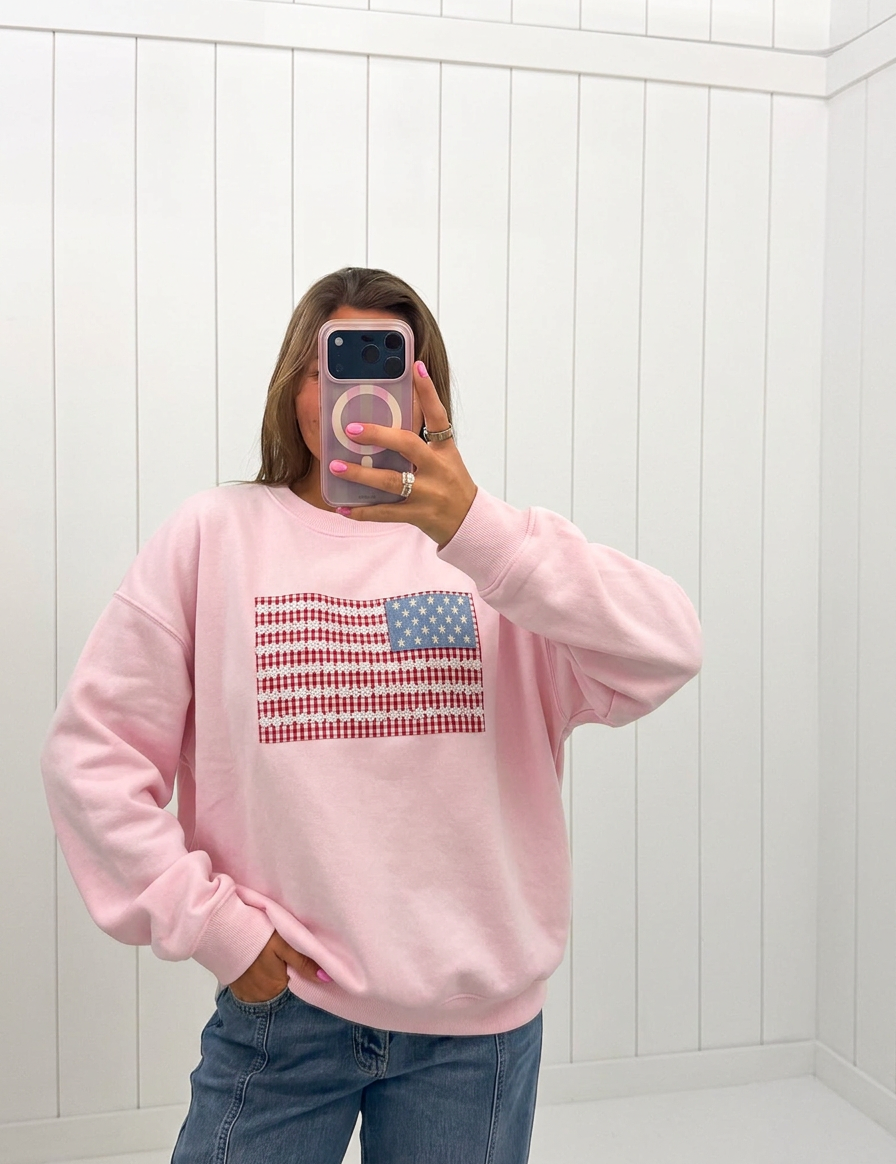 AI-assisted FASHN try-on of Pink Crewneck USA Flag Art Work on boutique owner.