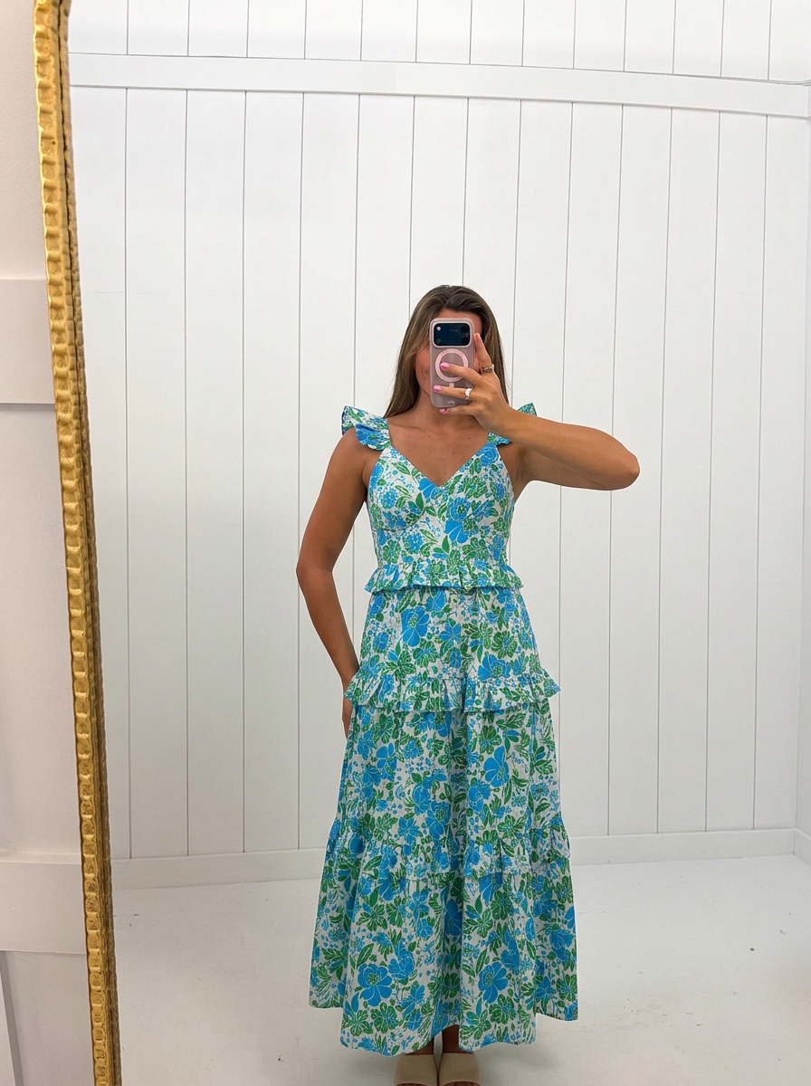 AI-assisted FASHN try-on of Bivore Floral Truth Tiered Maxi Dress on boutique owner.