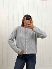 AI-assisted FASHN try-on of Light Grey Lightweight Button Cardigan on boutique owner.