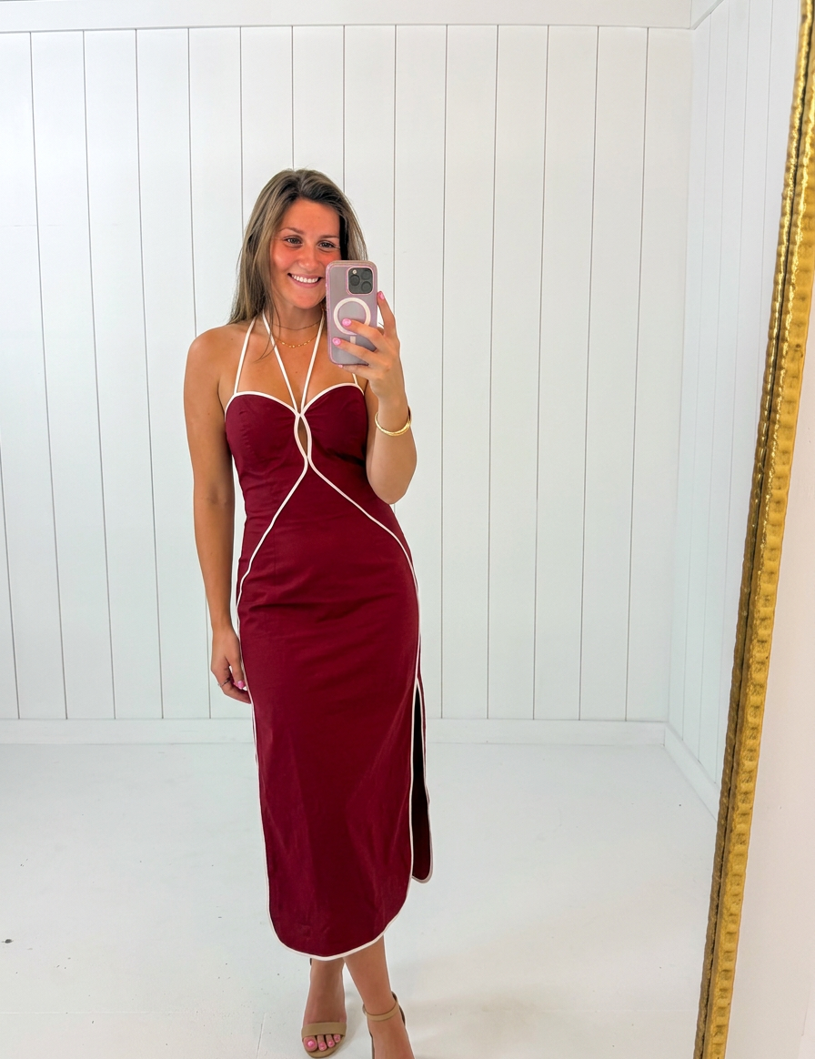 AI-assisted FASHN try-on of Red Halter Neck Midi Dress on boutique owner.