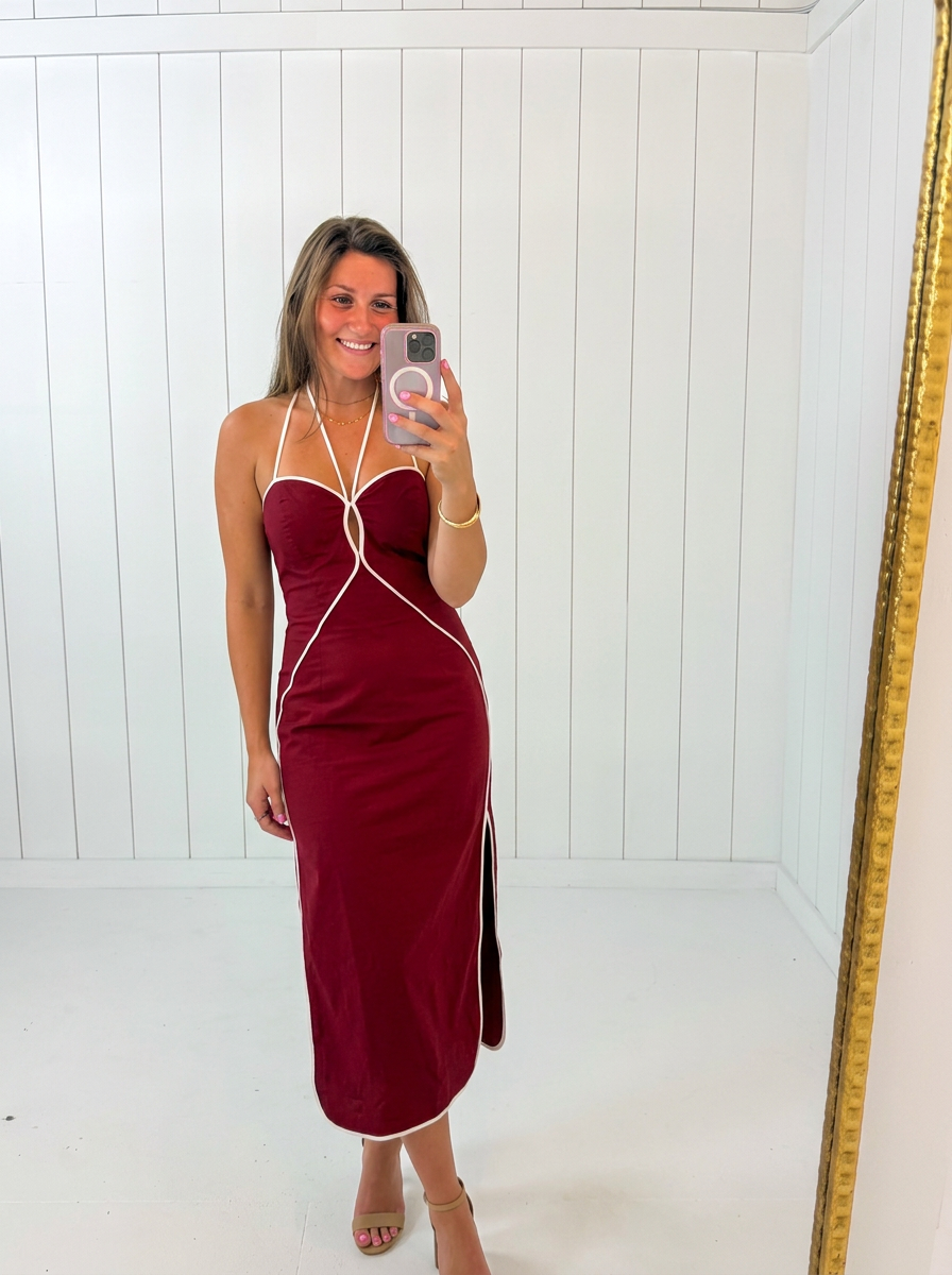 AI-assisted FASHN try-on of Red Halter Neck Midi Dress on boutique owner.