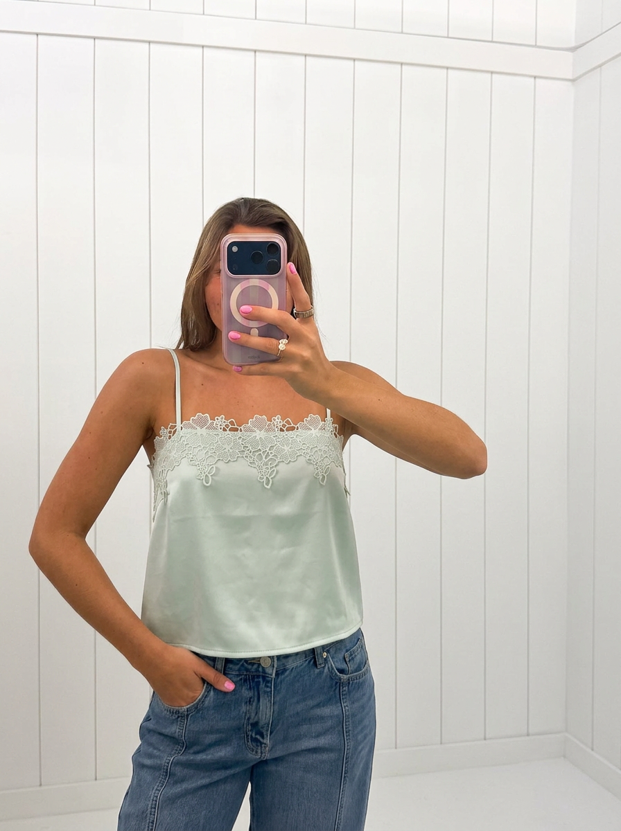 AI-assisted FASHN try-on of Mint Lace Satin Crop Top on boutique owner.