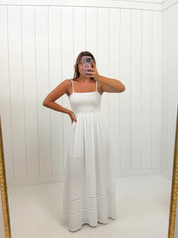 AI-assisted FASHN try-on of White Smocked Maxi Dress on boutique owner.