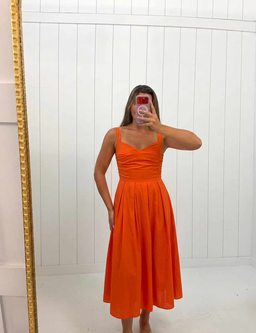 AI-assisted FASHN try-on of Red Valerie Fit And Flare Dress on boutique owner.