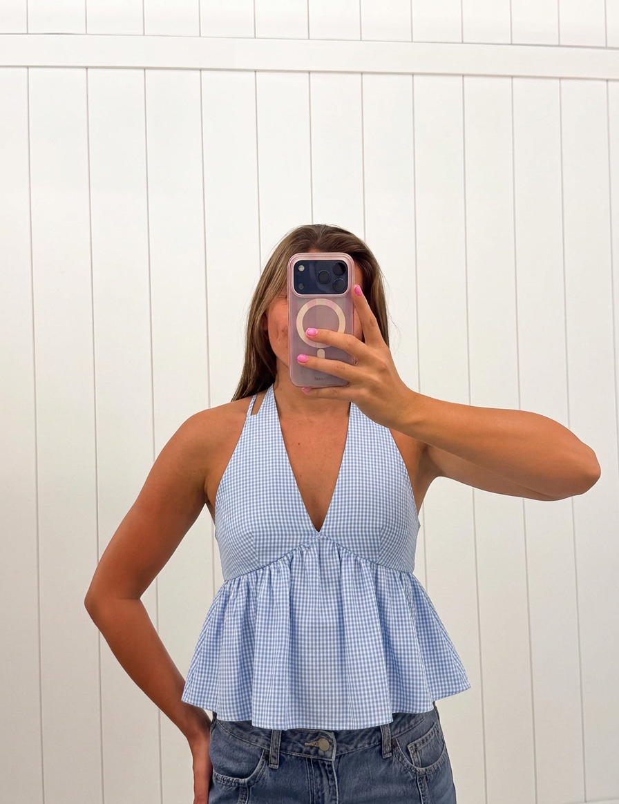 AI-assisted FASHN try-on of Blue Gingham Halter Top on boutique owner.