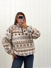 AI-assisted FASHN try-on of Cream Patterned Fleece Pullover on boutique owner.