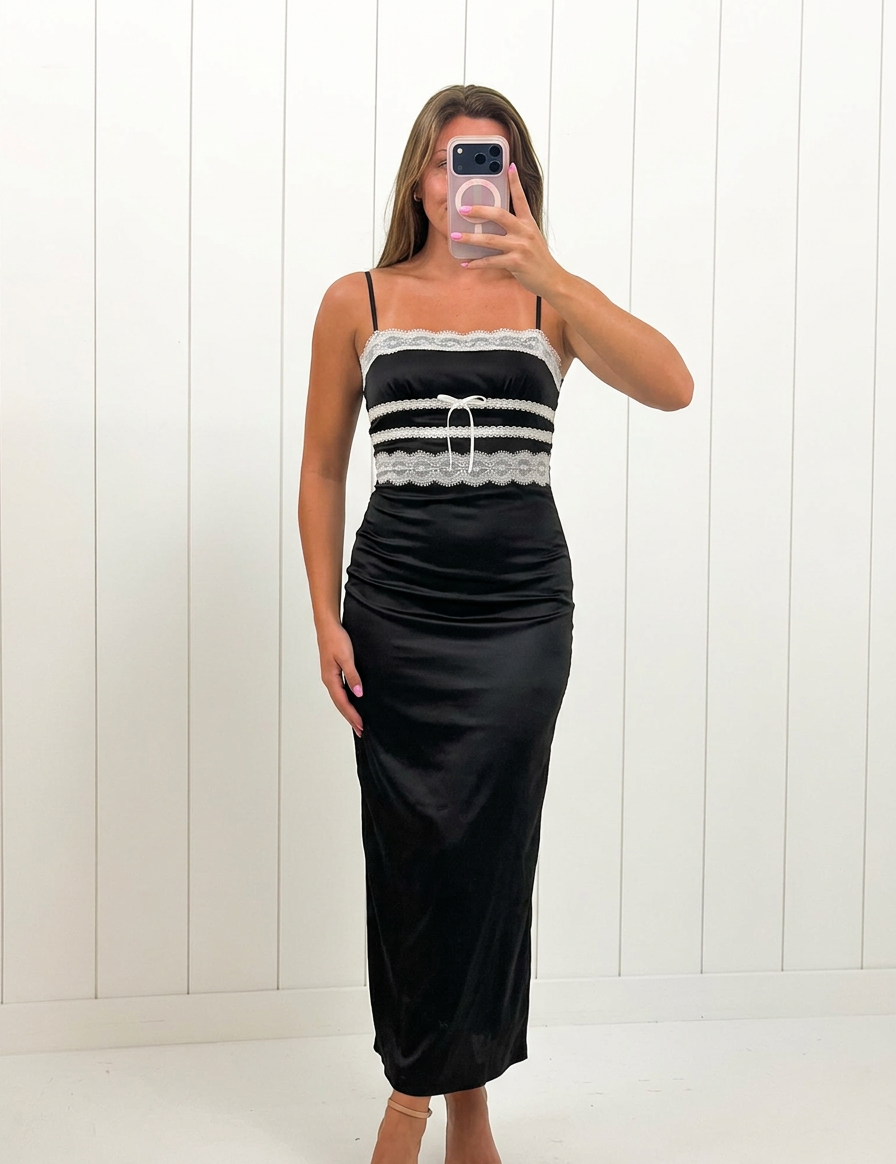 AI-assisted FASHN try-on of Black Lace Detail Maxi Dress on boutique owner.
