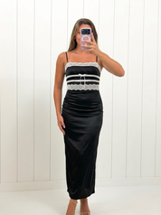 AI-assisted FASHN try-on of Black Lace Detail Maxi Dress on boutique owner.