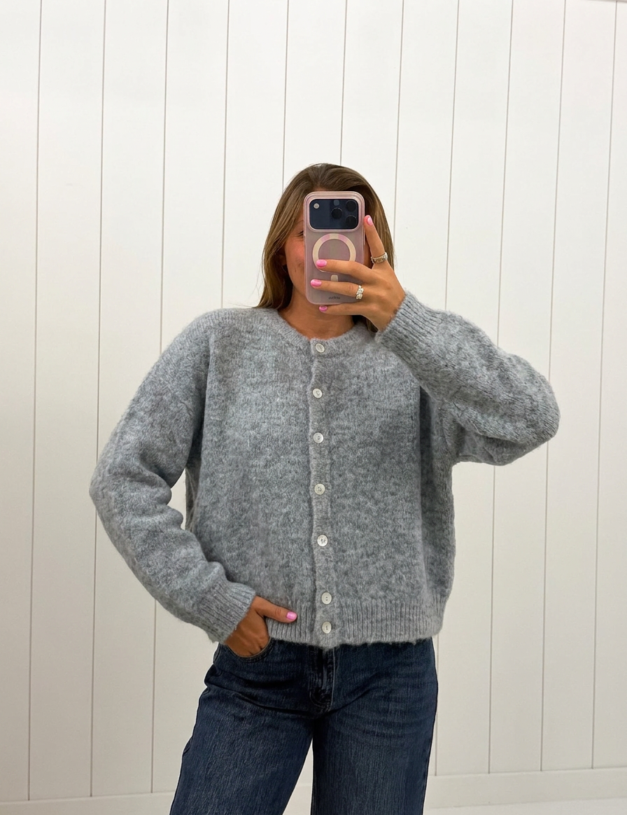 AI-assisted FASHN try-on of Gray Lucas Cardigan on boutique owner.