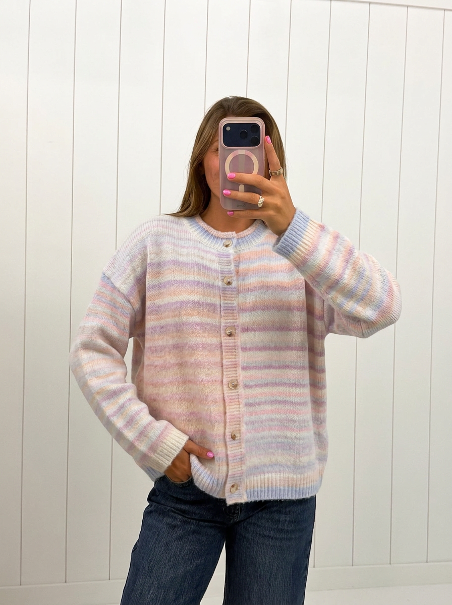 AI-assisted FASHN try-on of Pastel Multi Color Button Up Cardigan on boutique owner.
