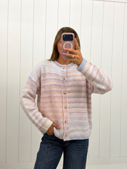 AI-assisted FASHN try-on of Pastel Multi Color Button Up Cardigan on boutique owner.
