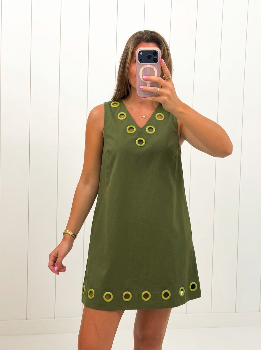 AI-assisted FASHN try-on of Green Sleeveless Mini Dress on boutique owner.