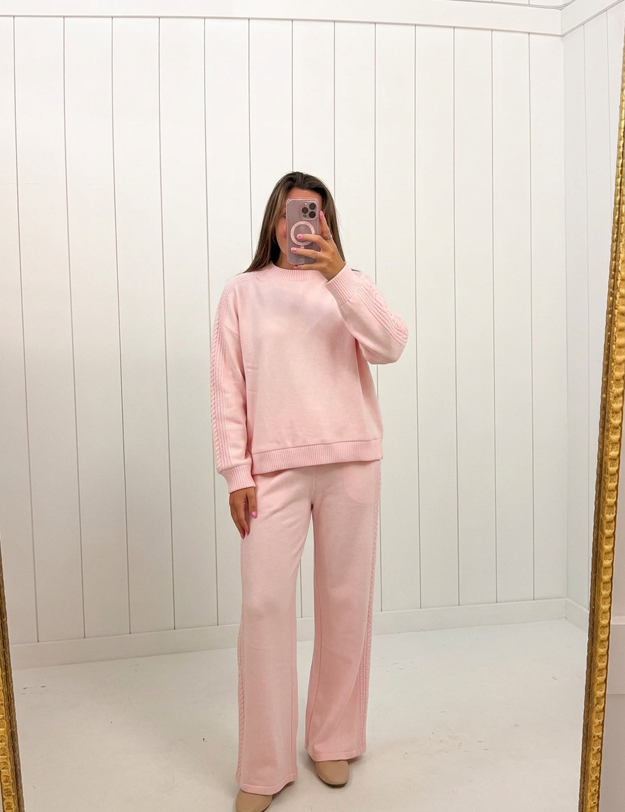 AI-assisted FASHN try-on of Pink Knit Oversized Set on boutique owner; approved September 24, 2026 redo using IMG_5127.jpeg.