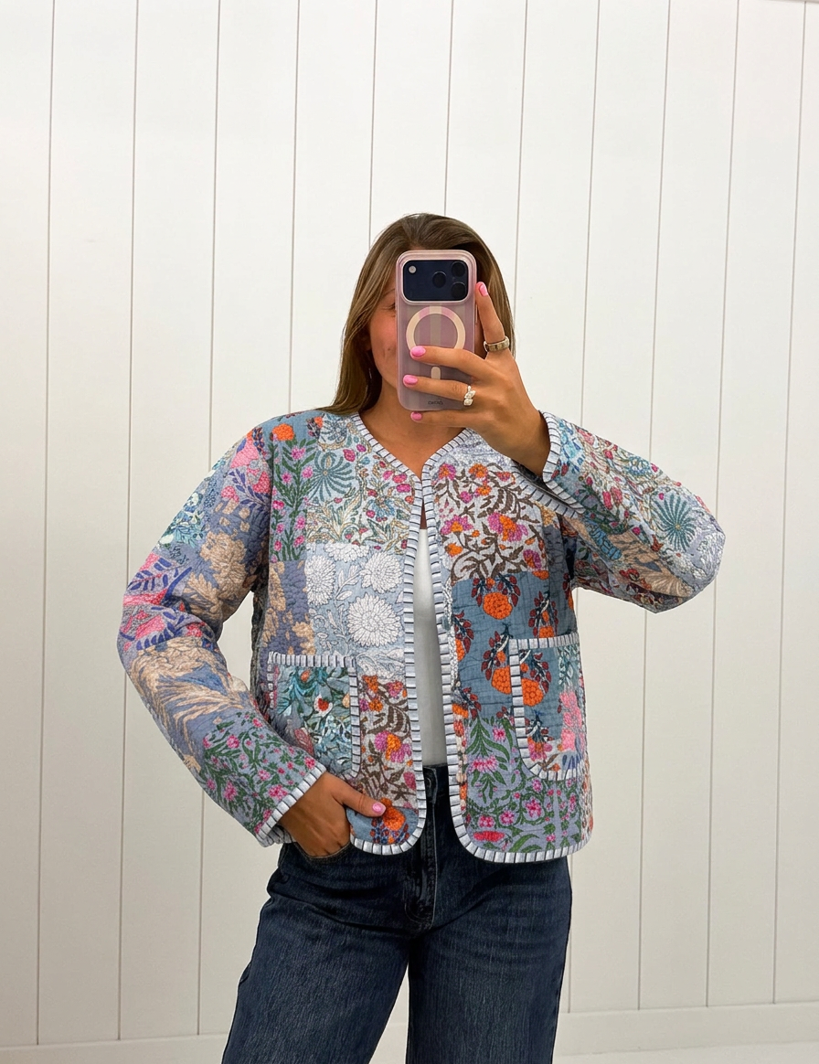 AI-assisted FASHN try-on of Gray Floral Print Quilted Patch Jacket on boutique owner.