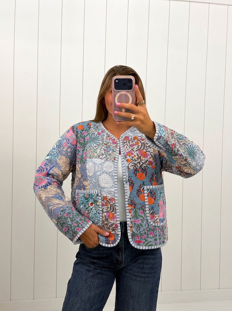 AI-assisted FASHN try-on of Gray Floral Print Quilted Patch Jacket on boutique owner.