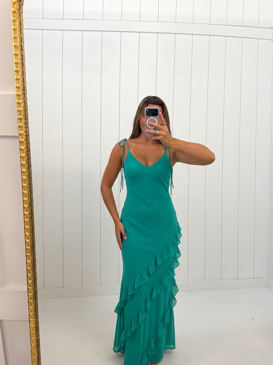 AI-assisted FASHN try-on of Green Ruffled Tiered Maxi Dress on boutique owner.