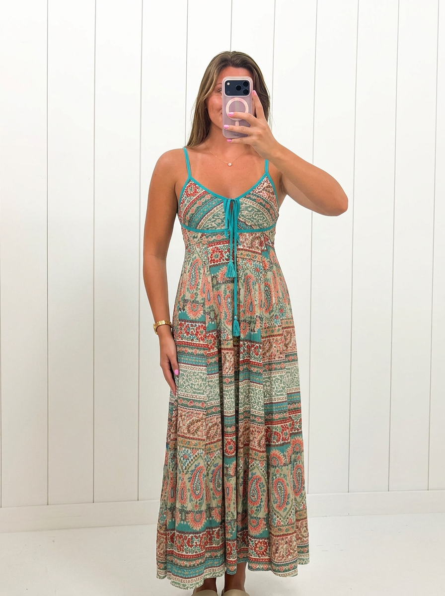 AI-assisted FASHN try-on of Contrast Printed Maxi Dress on boutique owner.