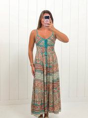 AI-assisted FASHN try-on of Contrast Printed Maxi Dress on boutique owner.