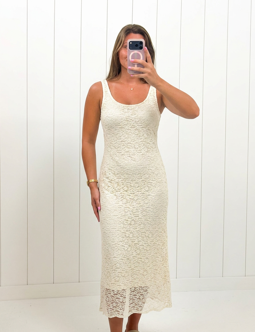 AI-assisted FASHN try-on of Cream Floral Lace Midi Dress on boutique owner.