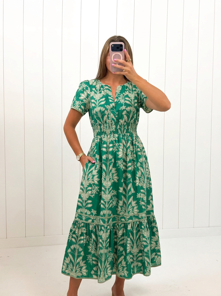 AI-assisted FASHN try-on of Green Smocked Midi Floral Dress on boutique owner.