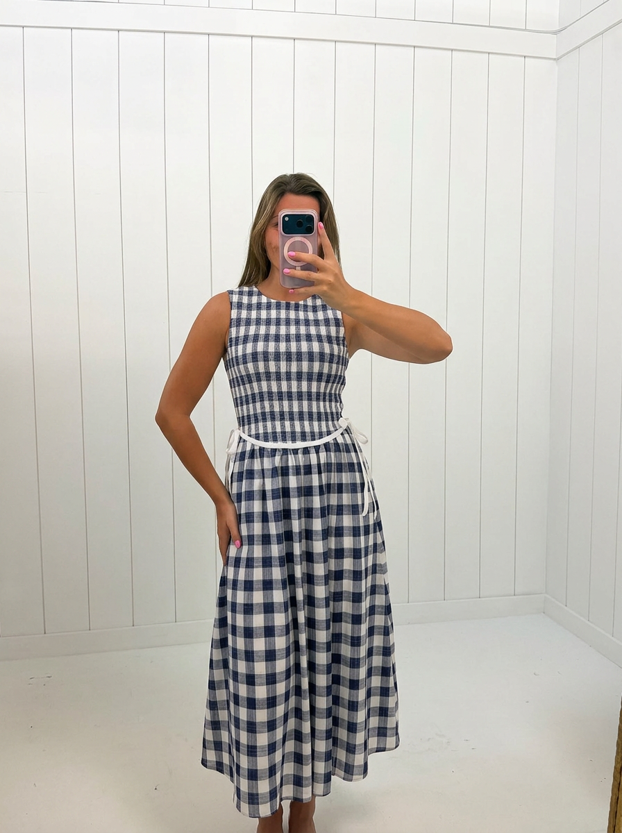 AI-assisted FASHN try-on of Gingham Sleeveless Midi Dress on boutique owner.