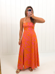AI-assisted FASHN try-on of Kaci Floral Vin Smocked Maxi Dress on boutique owner.