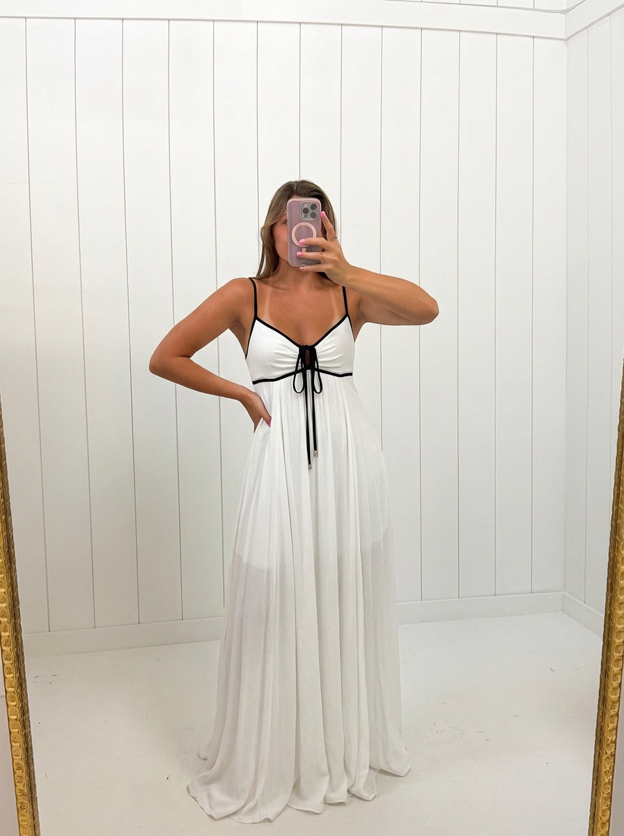 AI-assisted FASHN try-on of White Sian Contrast Tie Maxi Dress on boutique owner.