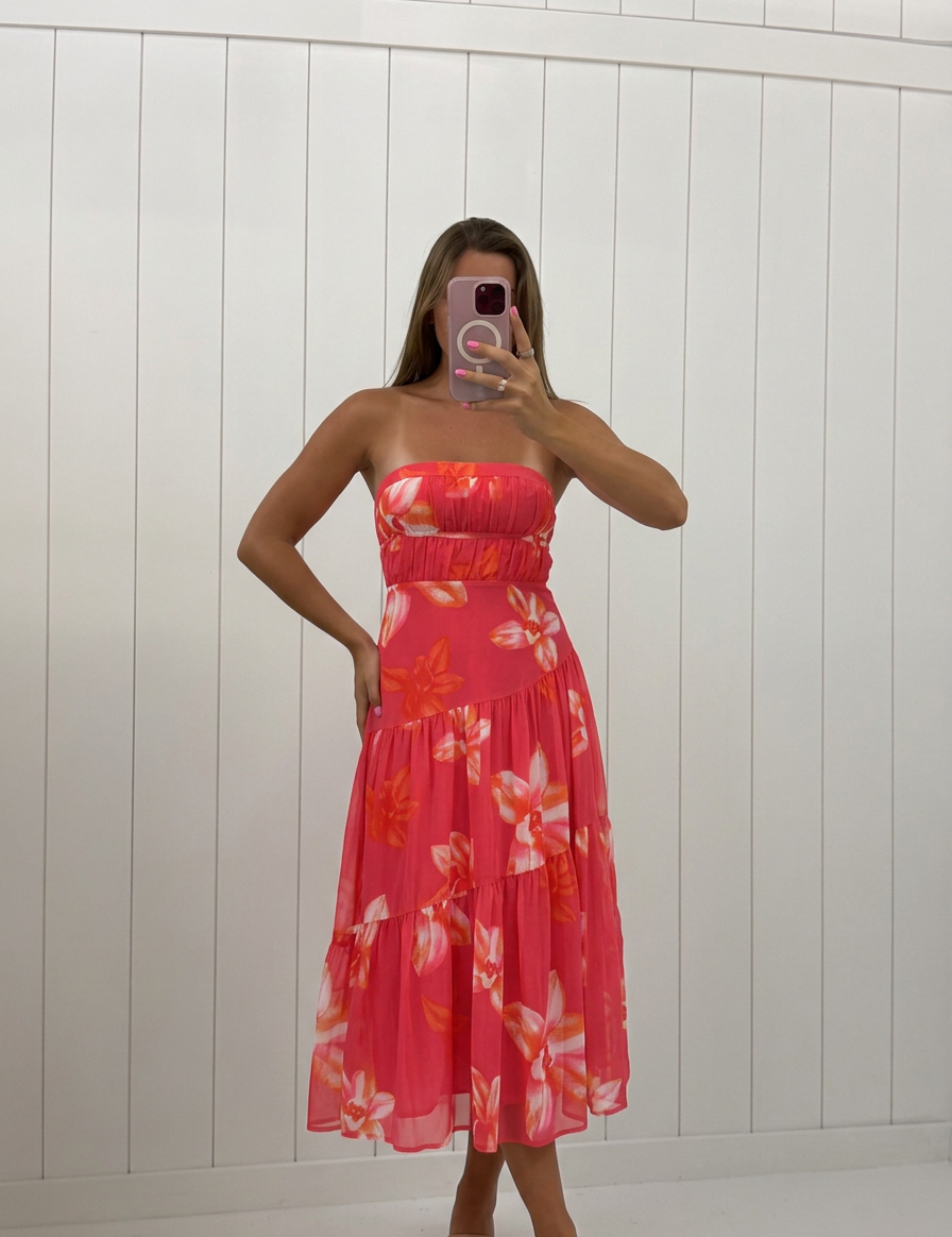 AI-assisted FASHN try-on of Hot Pink Strapless Floral Midi dress on boutique owner.