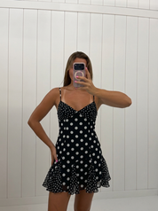 AI-assisted FASHN try-on of Black Polka Dot Mini Dress on boutique owner.
