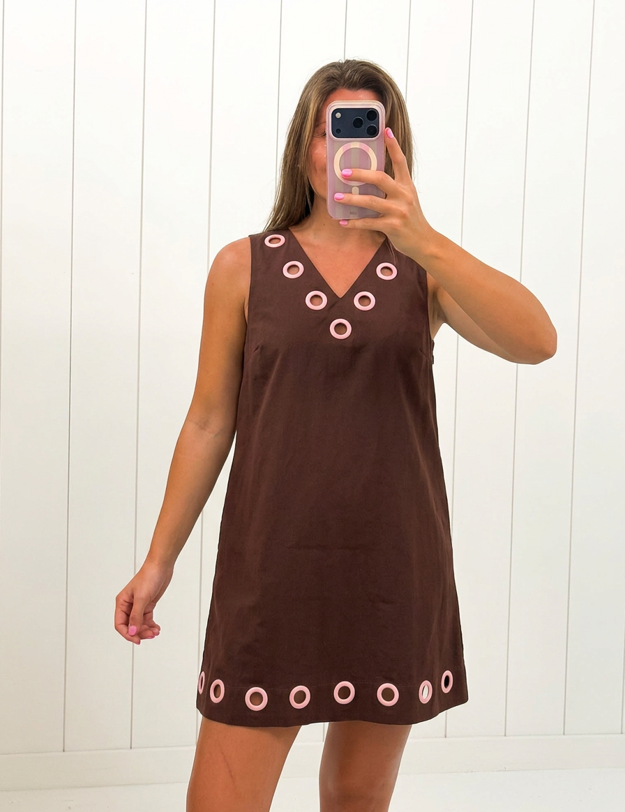 AI-assisted FASHN try-on of Brown Sleeveless Mini Dress on boutique owner.