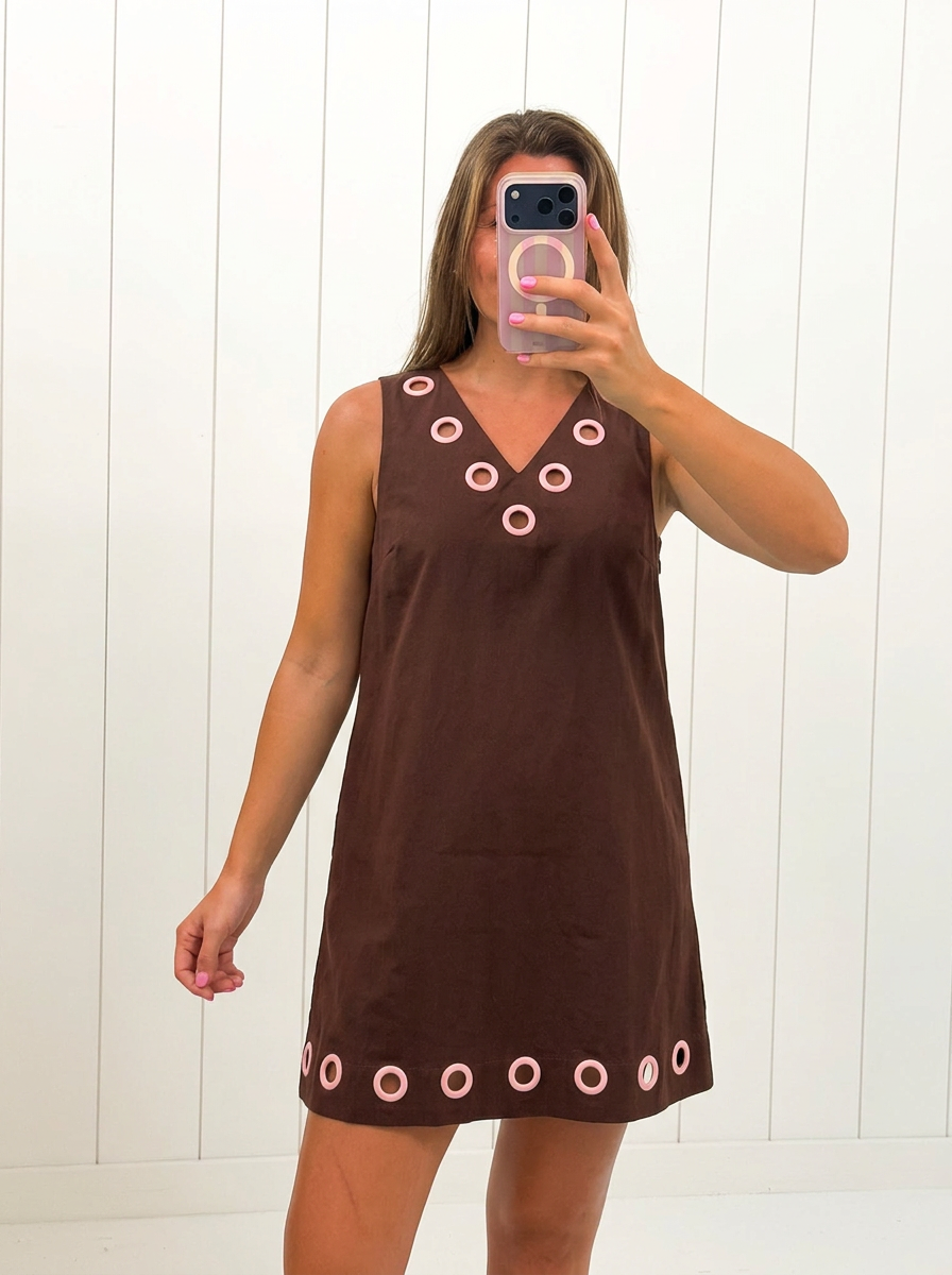 AI-assisted FASHN try-on of Brown Sleeveless Mini Dress on boutique owner.