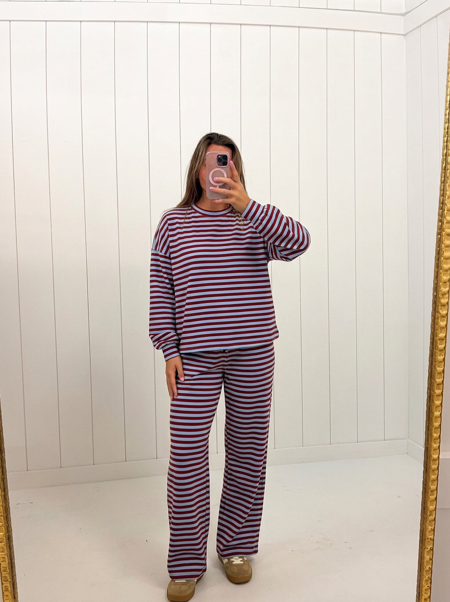 AI-assisted FASHN try-on of Red &amp; Blue Stripe Pant Set on boutique owner.