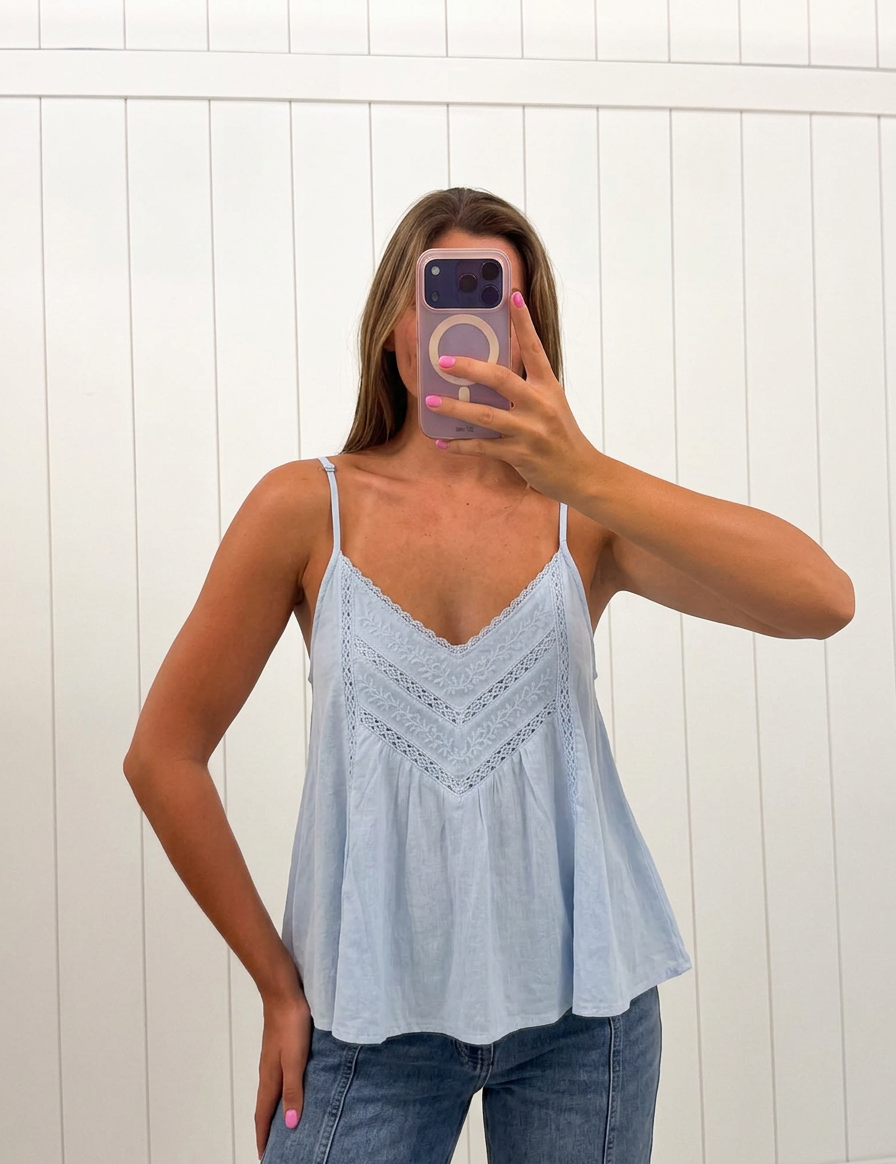 AI-assisted FASHN try-on of Spaghetti Strap Lace Trim Top on boutique owner.