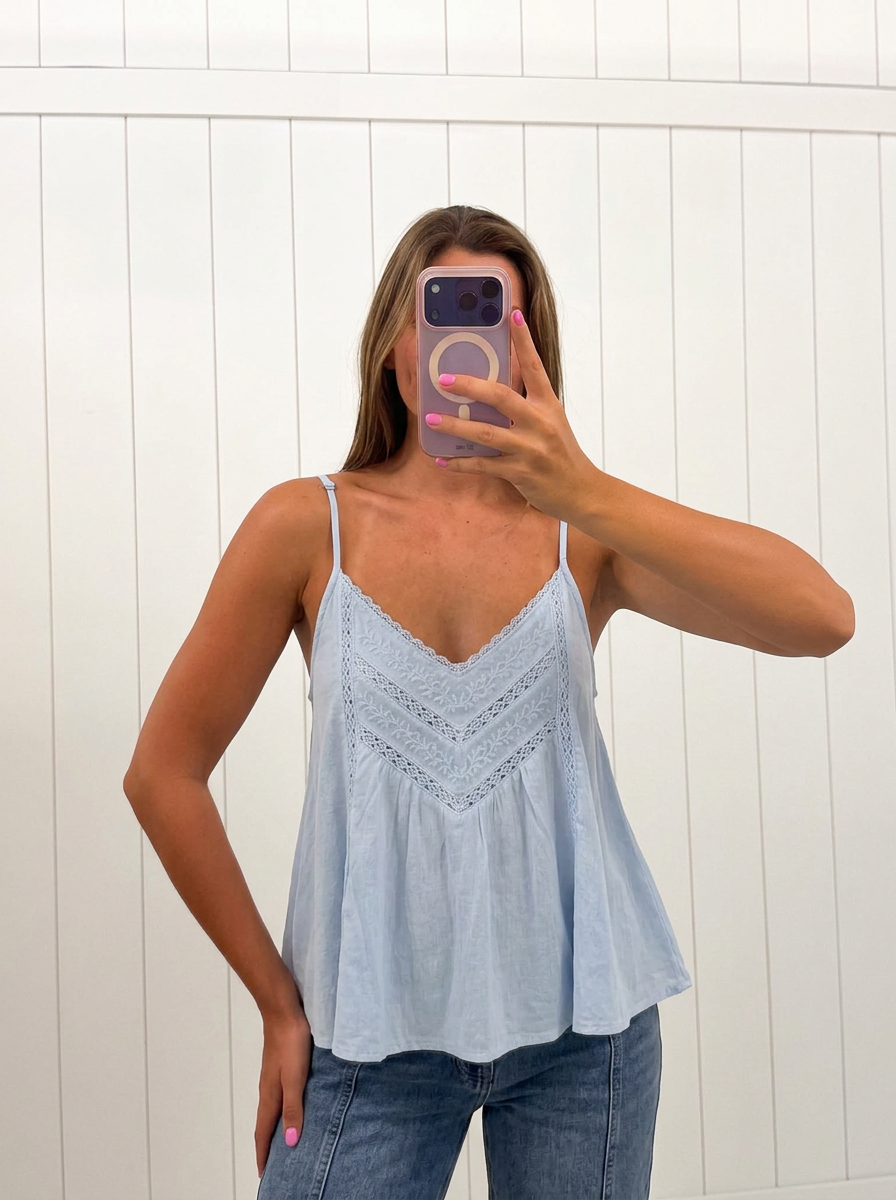 AI-assisted FASHN try-on of Spaghetti Strap Lace Trim Top on boutique owner.