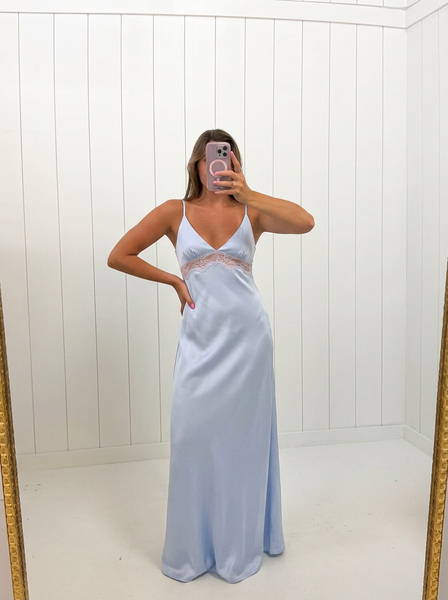 AI-assisted FASHN try-on of Light Blue Satin Lace Maxi Dress on boutique owner.