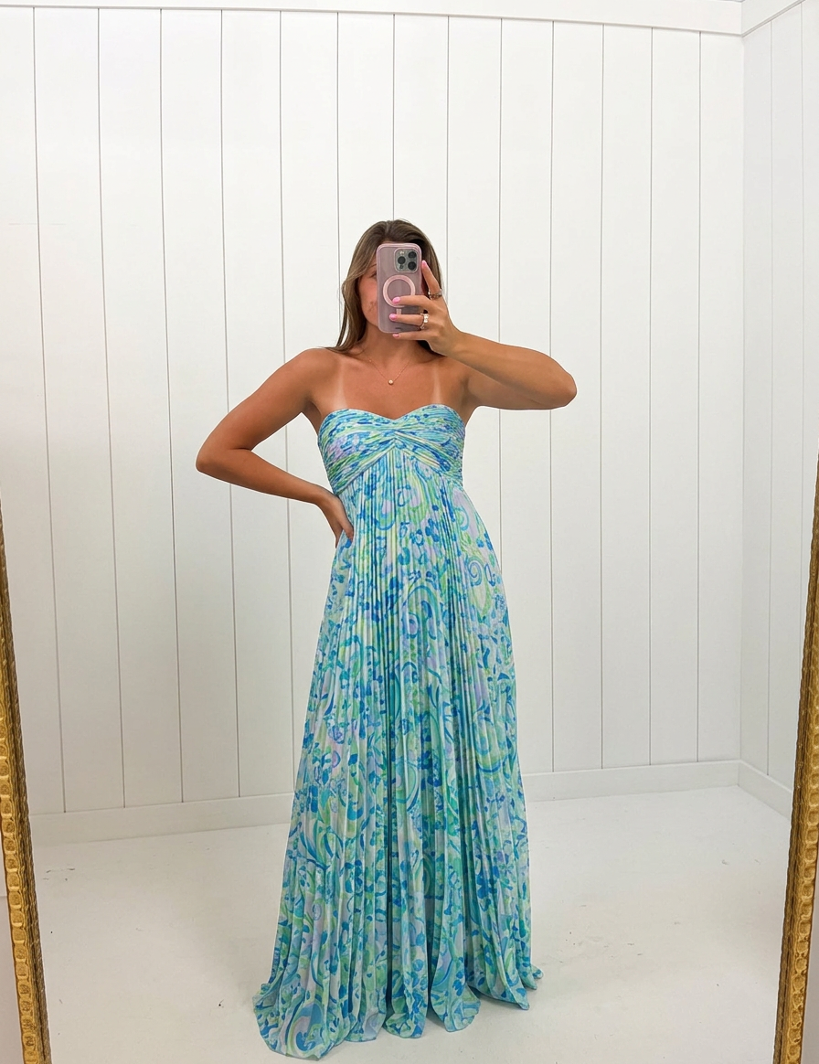 AI-assisted FASHN try-on of Blue Waive Accordion Maxi Dress on boutique owner.