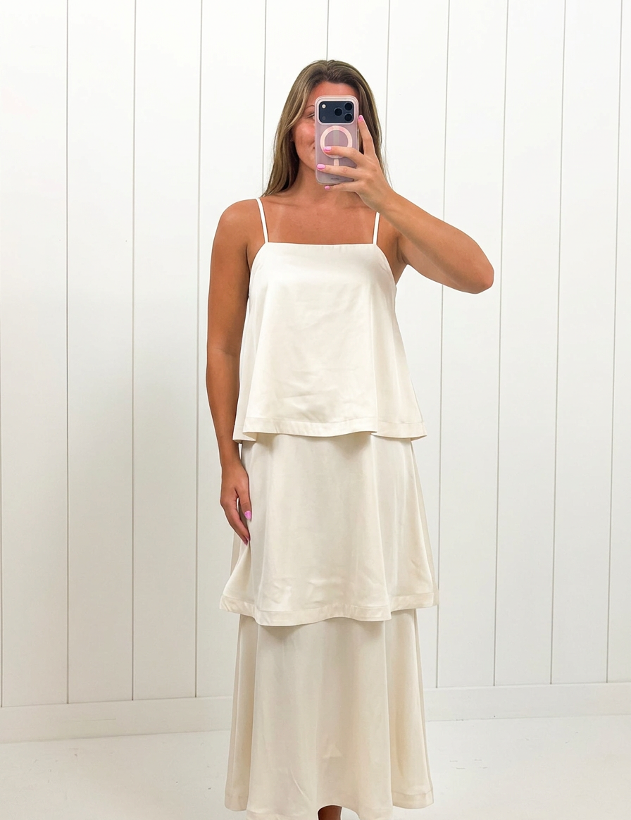 AI-assisted FASHN try-on of Cream Satin Tiered Maxi Dress on boutique owner.