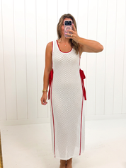 AI-assisted FASHN try-on of White & Red Bow Ribbon Knit Dress on boutique owner; approved September 24, 2026 redo using IMG_4945.jpeg.